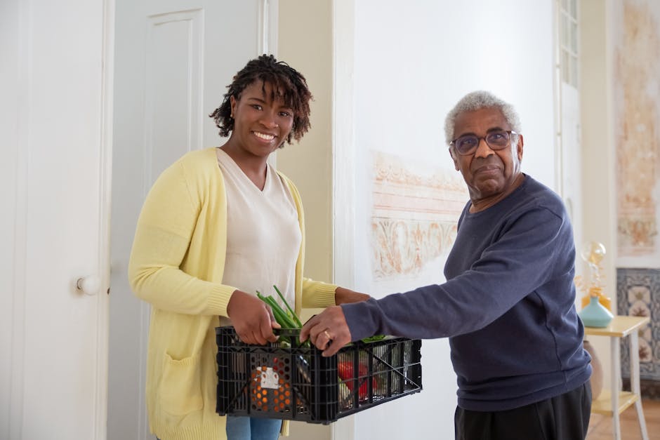 Caregiver assisting senior man with meal at home