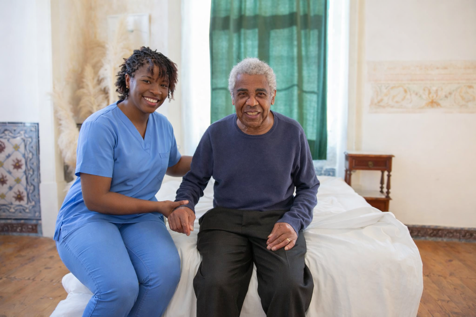 Nurse sitting with elderly patient at home